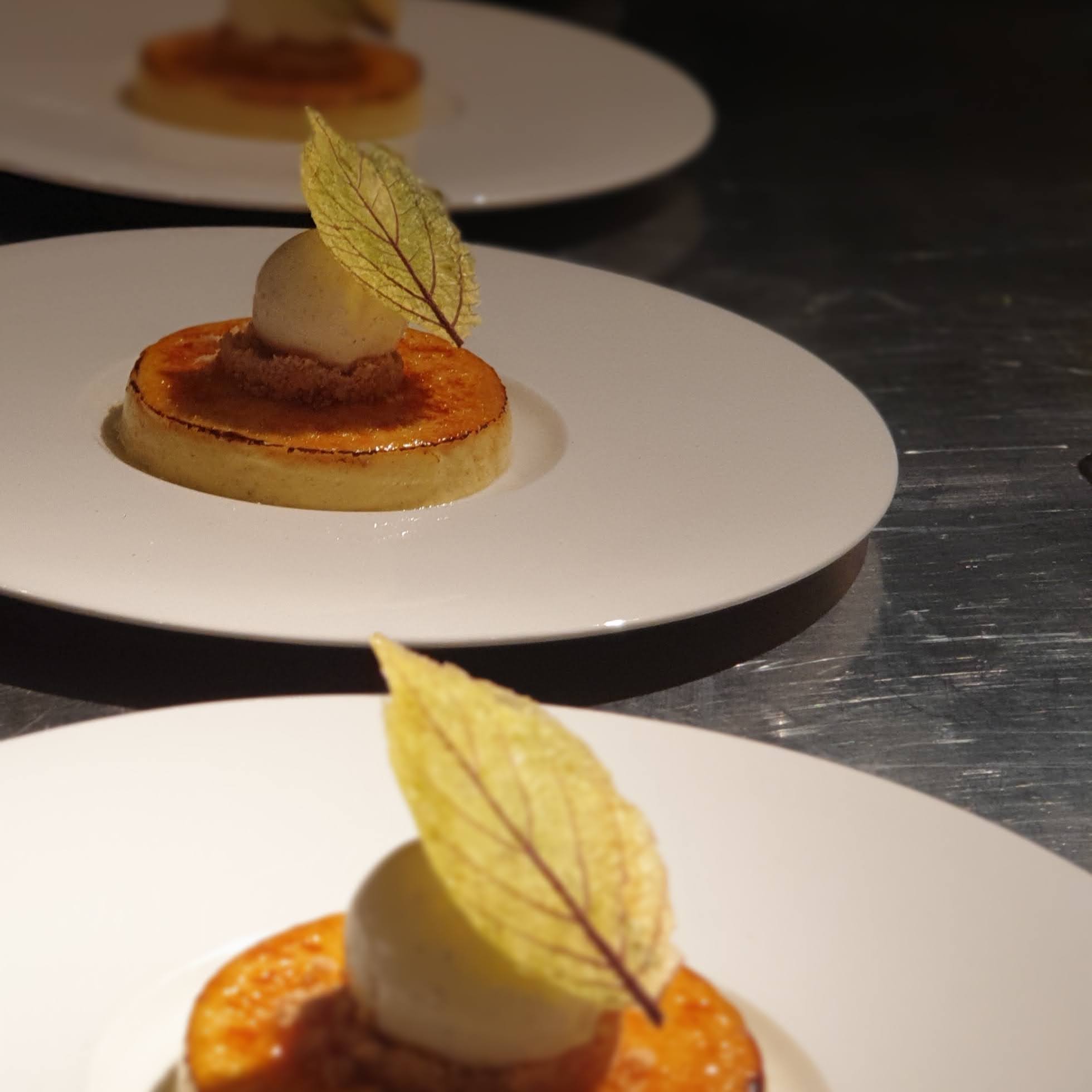 Brûléed tart with spiced ice cream and a translucent leaf tuile